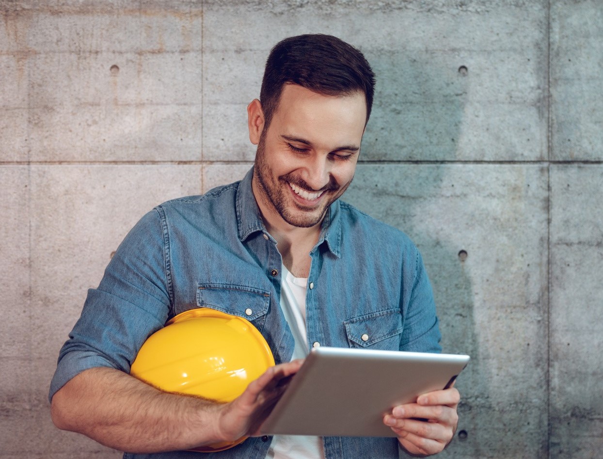 Man using ERP rental software on a tablet